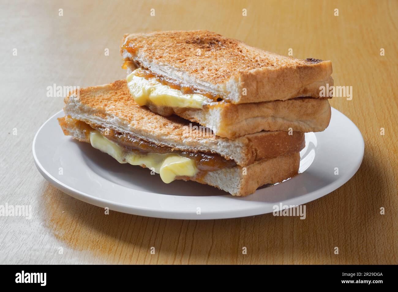 Kaya toast butter. Traditional oriental and vintage kopitiam breakfast style. Popular in Malaysian and Singaporean Stock Photo