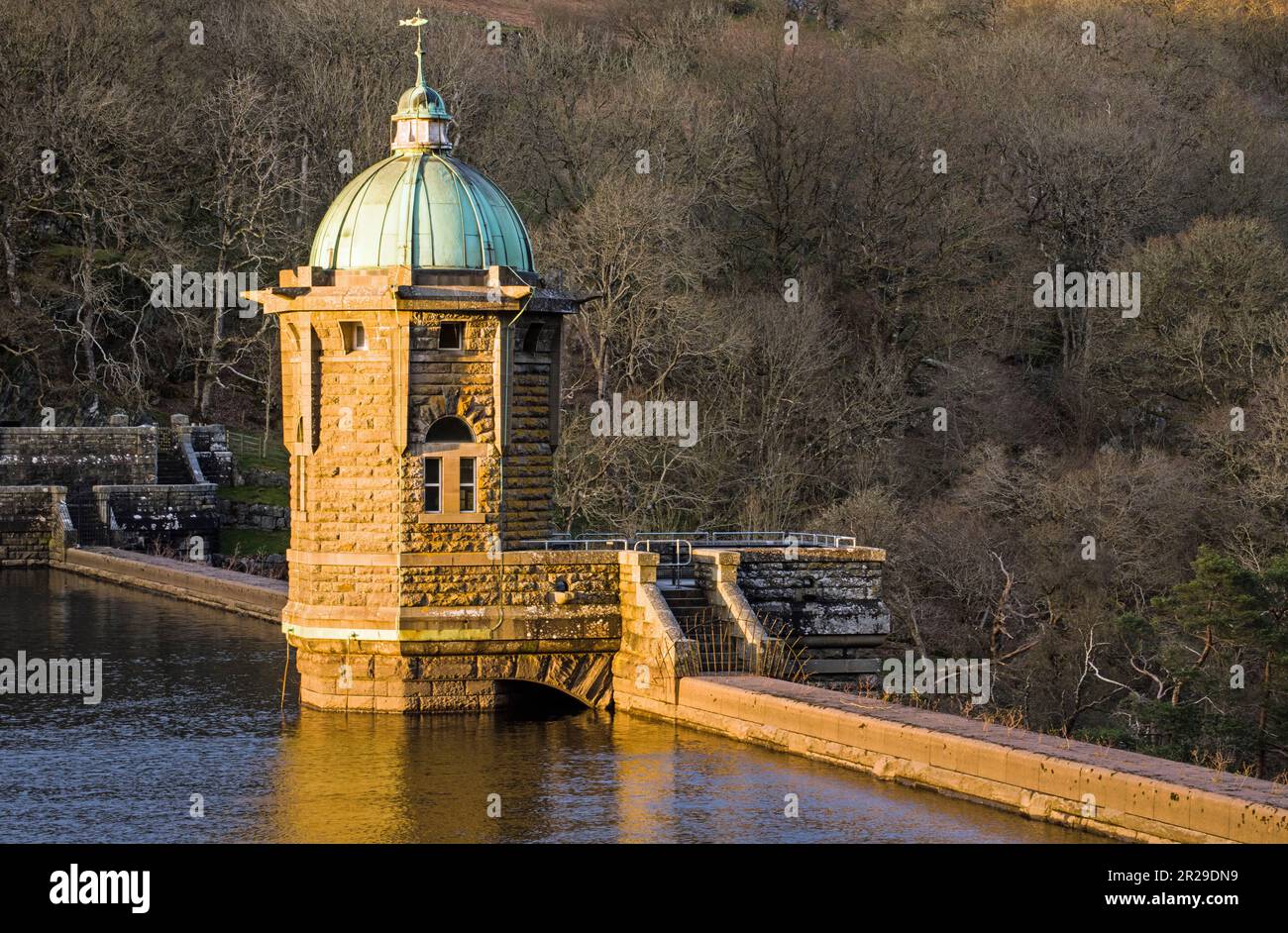 The Pen y Garreg Dam Control Tower in the Elan Valley in Powys with a low flash of sun brightening up the Tower and its Surrounds Stock Photo