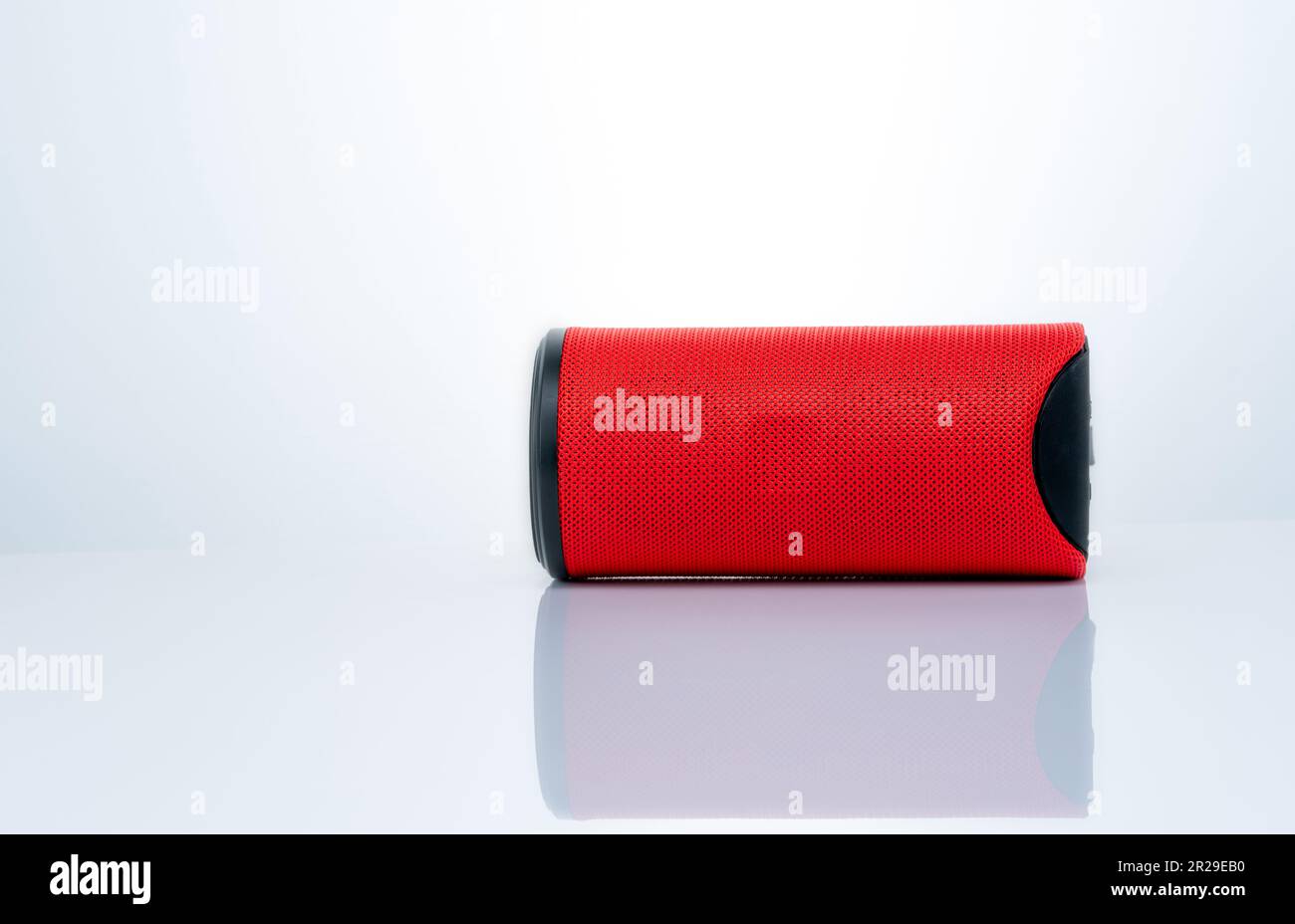 Wireless portable speaker isolated on white background. Red Digital ...