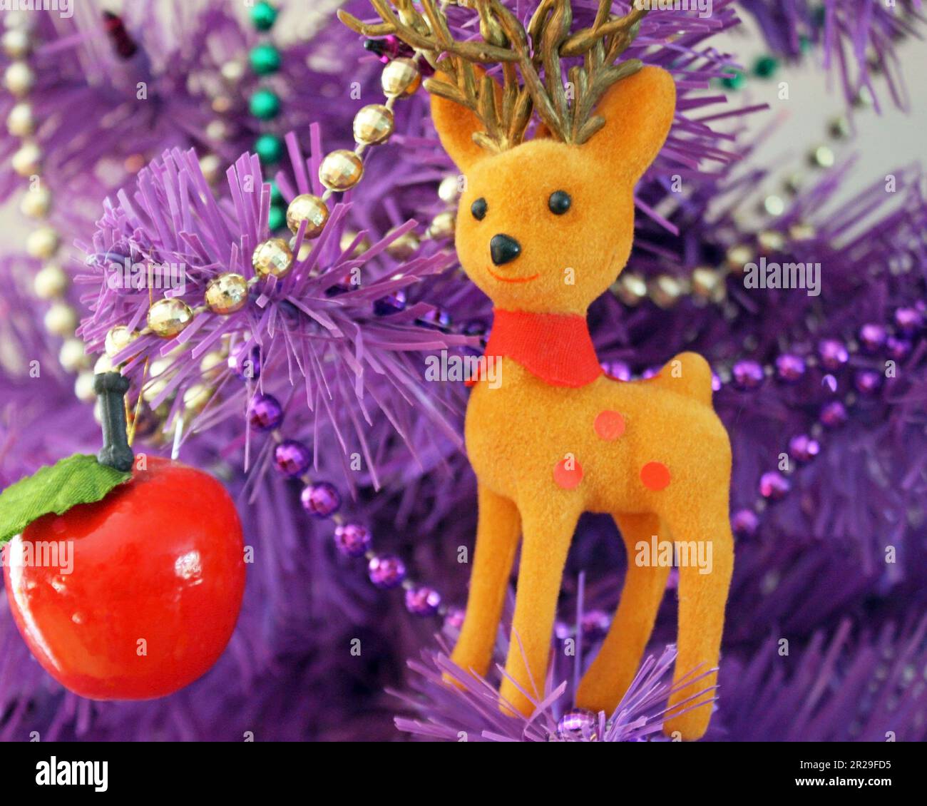 Close up of Christmas ornaments and decorations on an artificial tree Stock Photo