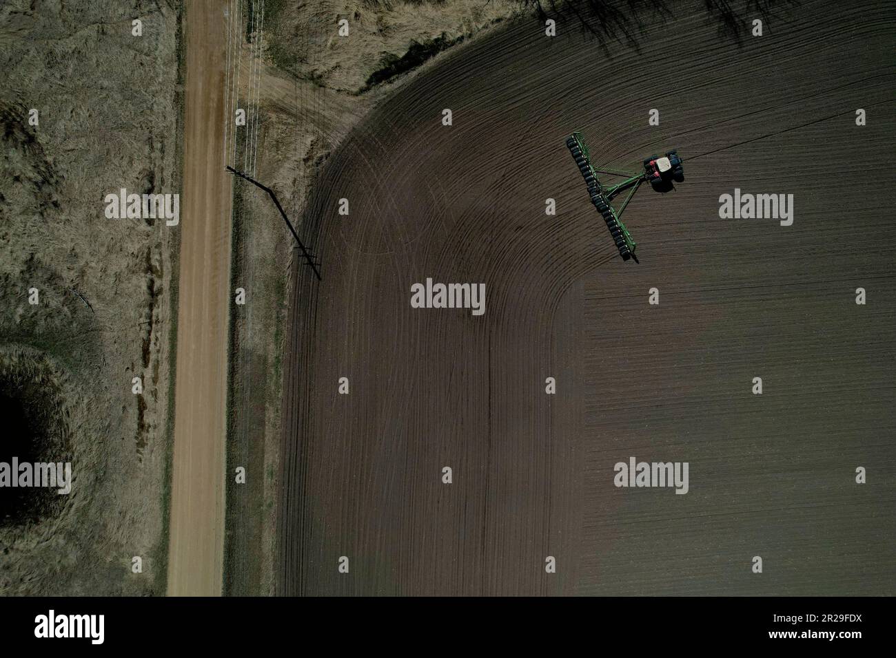 Crop farmer Bob Worth plants corn in one of the many fields on his ...