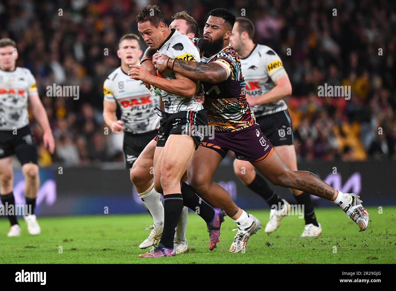 Scott Sorensen of the Panthers is tackled during the NRL Round 12 match  between the Brisbane Broncos and the Penrith Panthers at Suncorp Stadium in  Brisbane, Thursday, May 18, 2023. (AAP Image/Jono