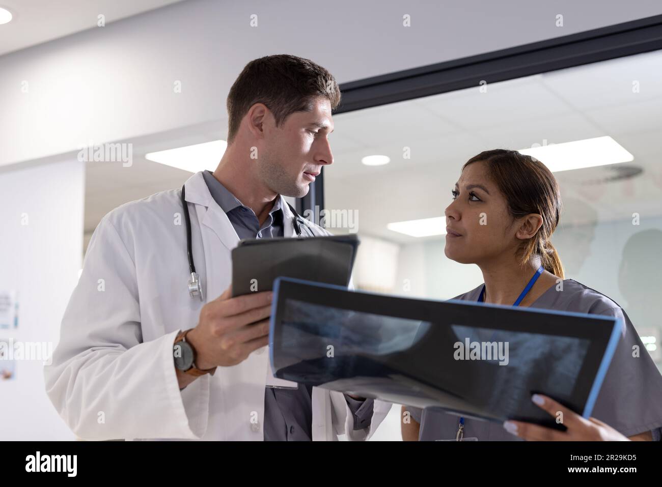Diverse male doctor tablet female hi-res stock photography and images ...