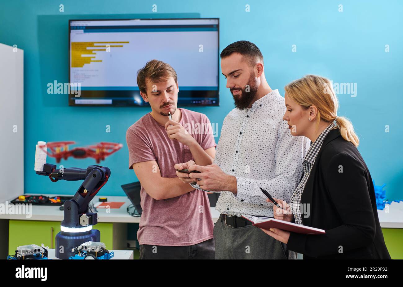 A group of students working together in a laboratory, dedicated to ...
