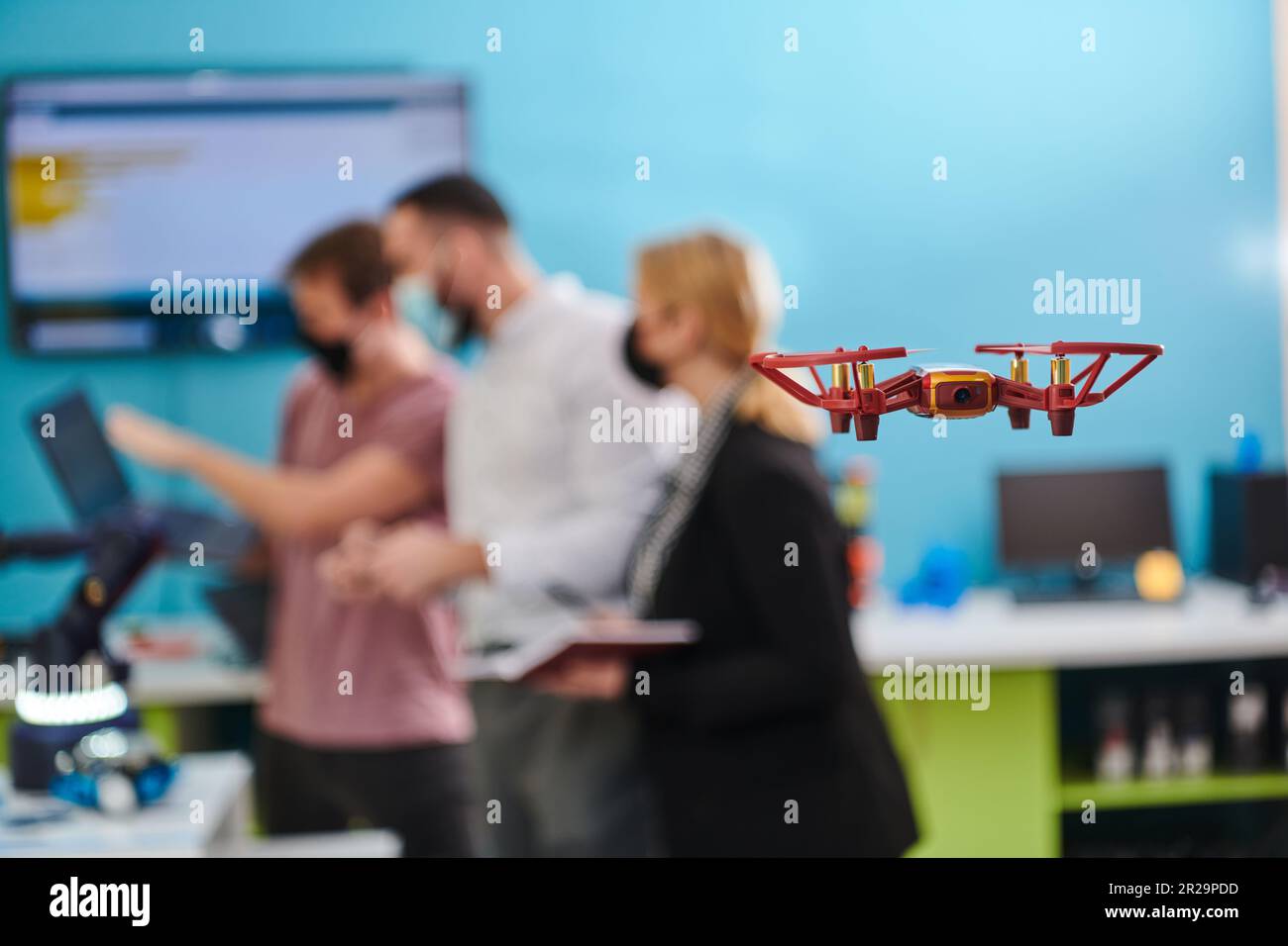 A group of students working together in a laboratory, dedicated to ...