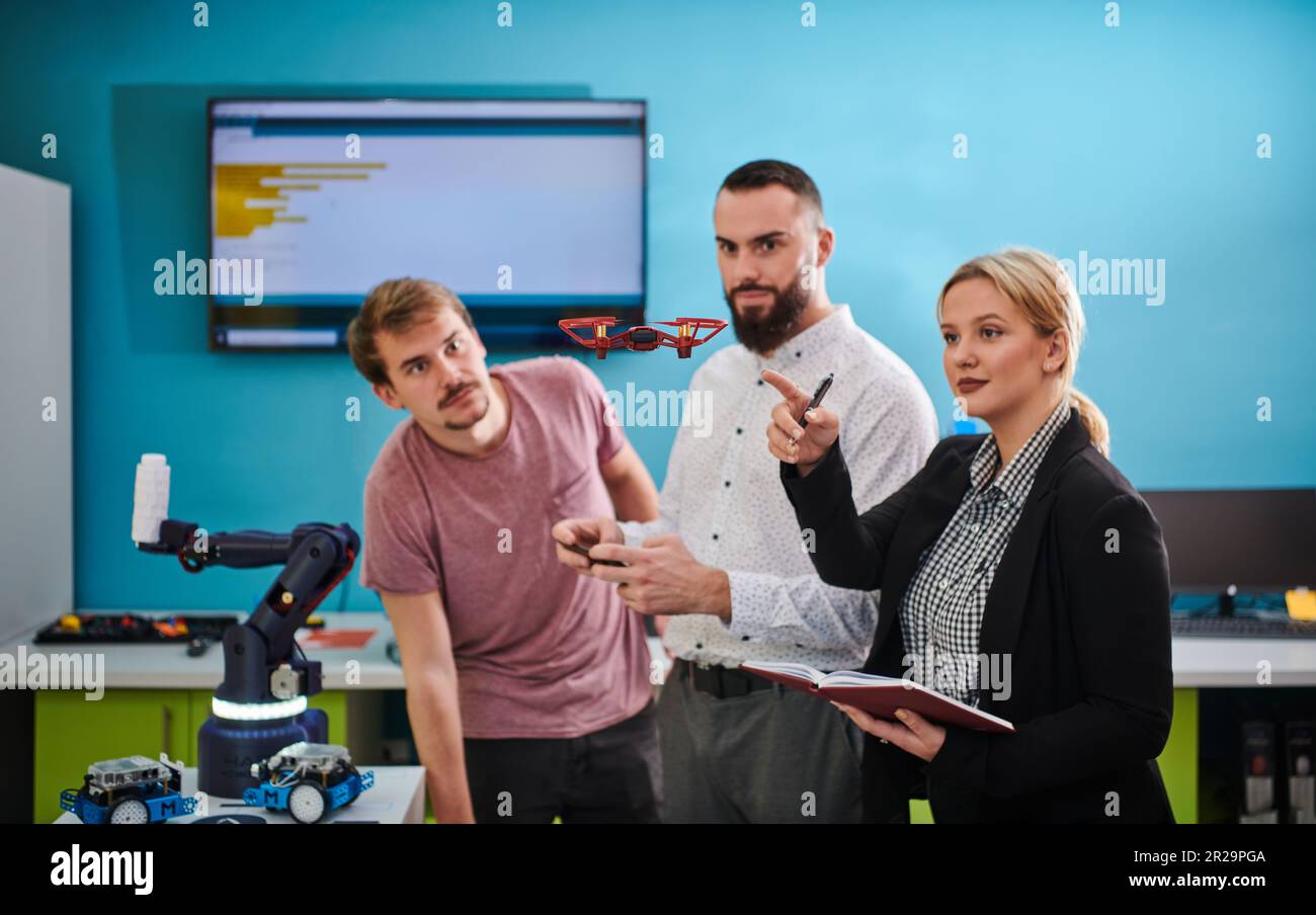 A group of students working together in a laboratory, dedicated to ...