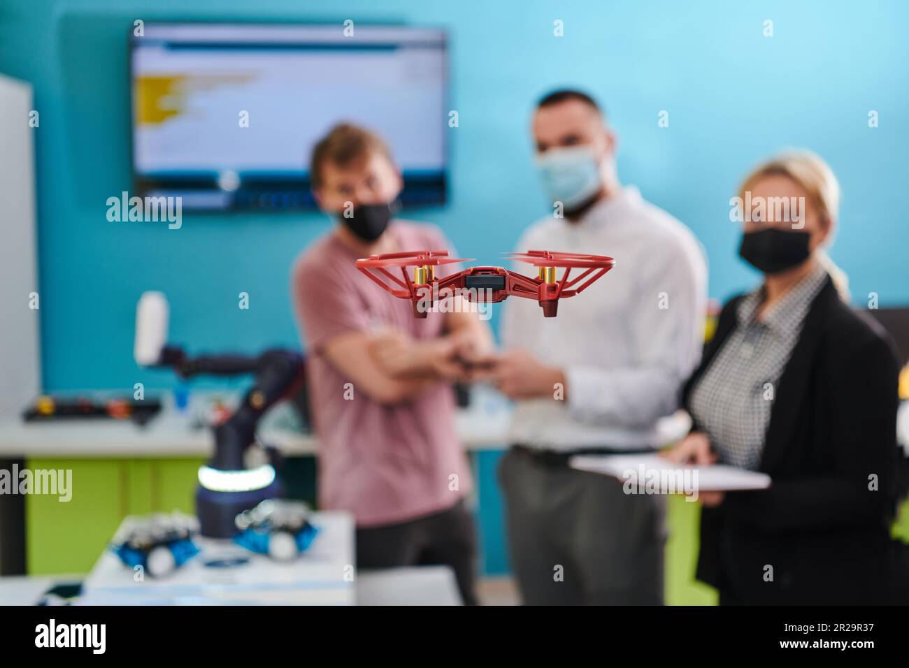 A group of students working together in a laboratory, dedicated to ...