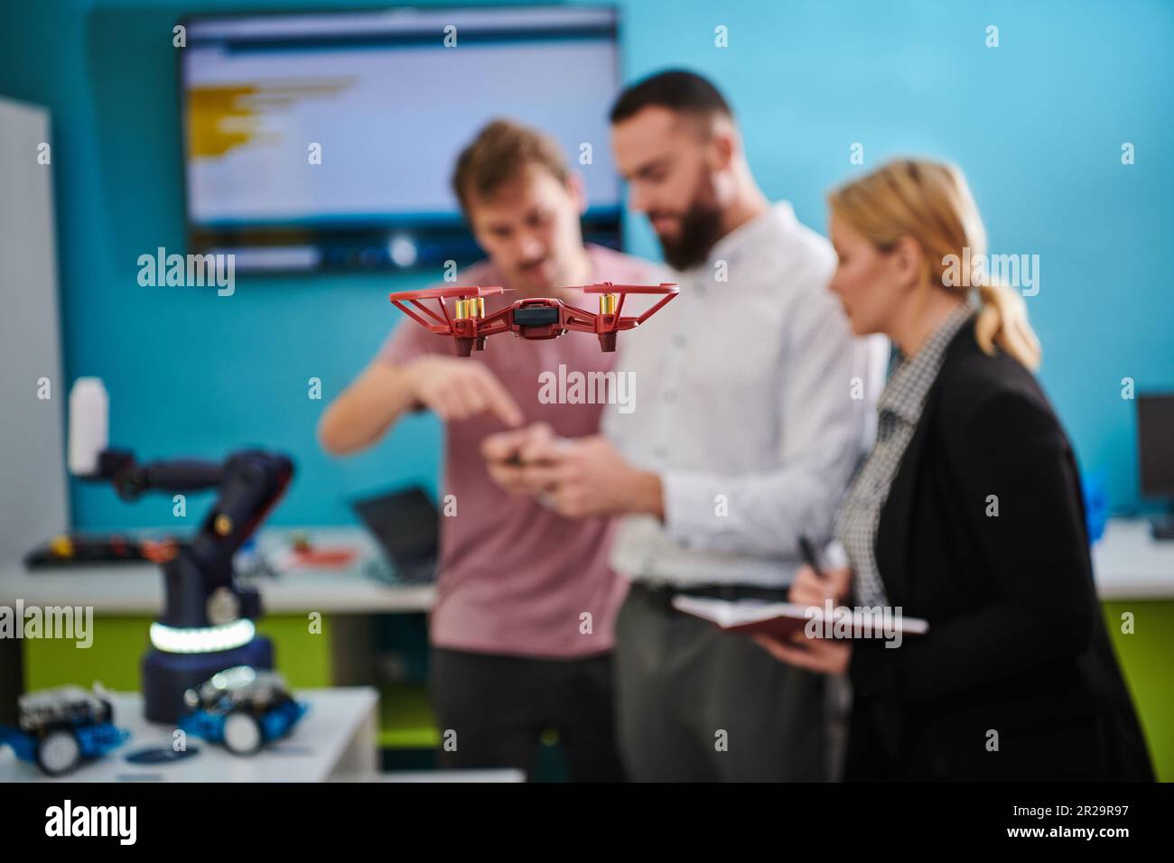 A group of students working together in a laboratory, dedicated to ...