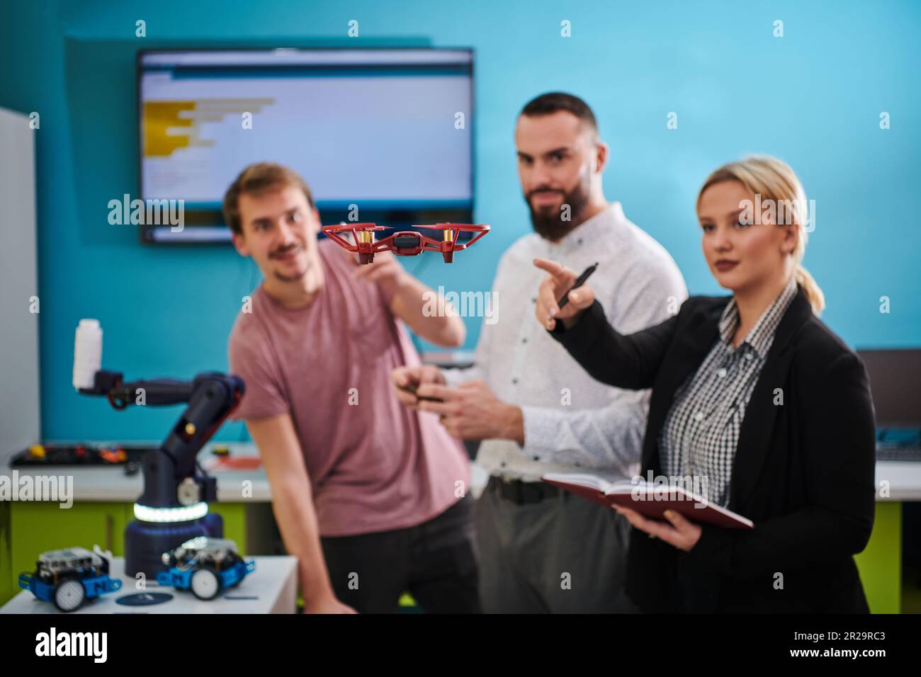 A group of students working together in a laboratory, dedicated to ...