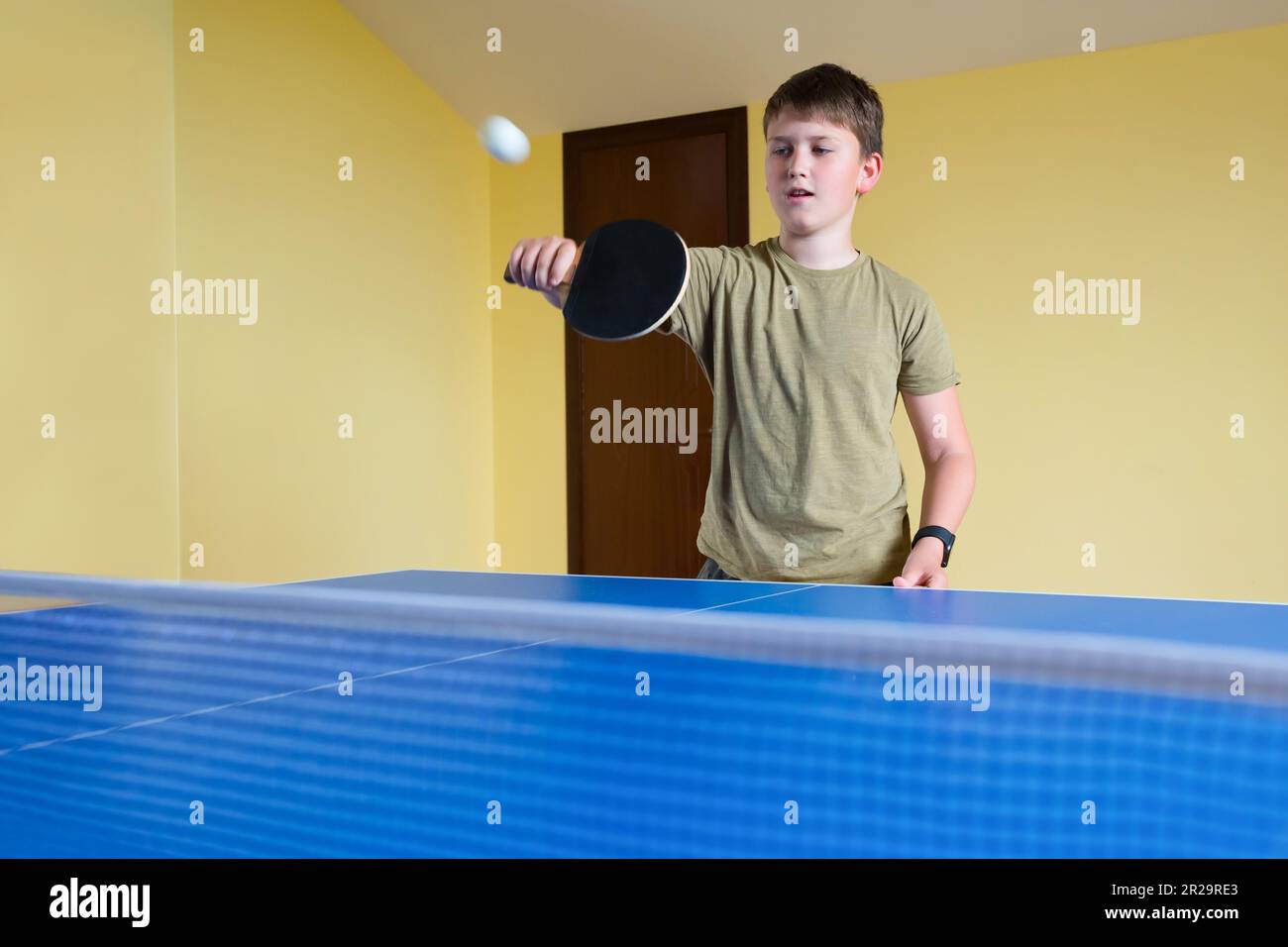 Cute boy playing table tennis indoors. Ping pong Stock Photo Alamy