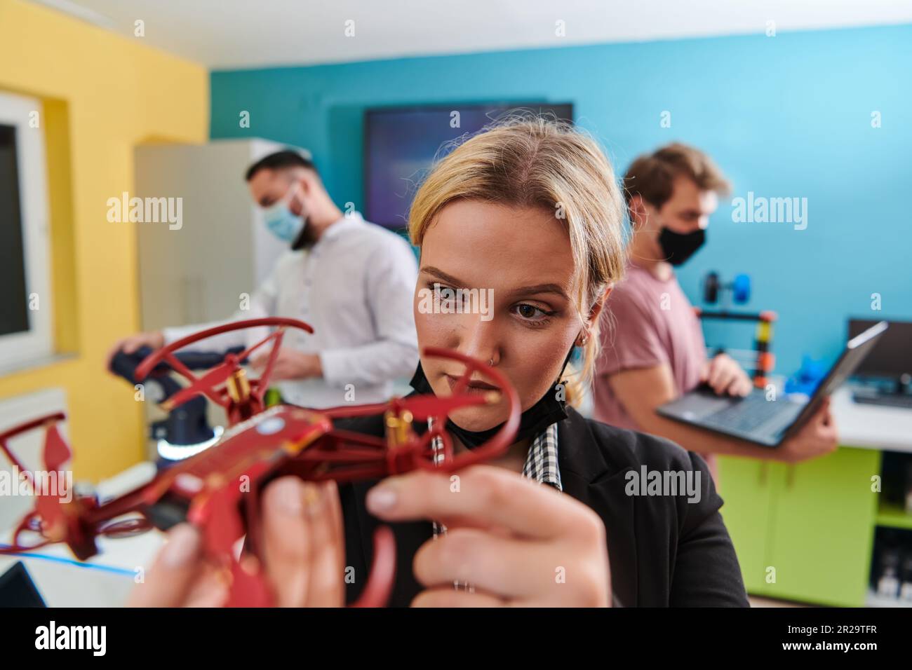 A group of students working together in a laboratory, dedicated to ...