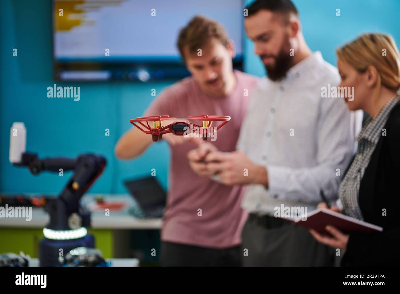 A group of students working together in a laboratory, dedicated to ...