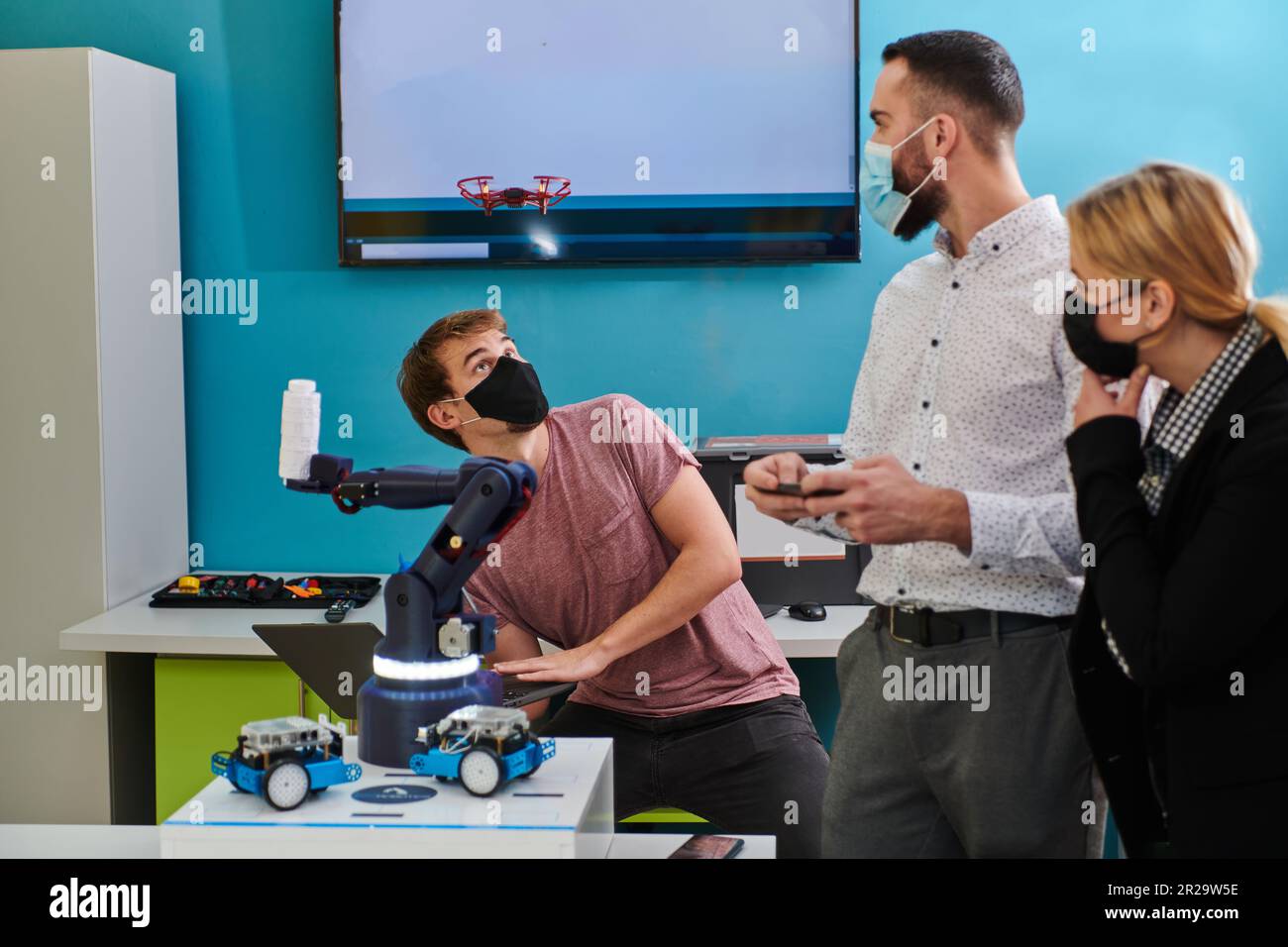 A group of students working together in a laboratory, dedicated to ...