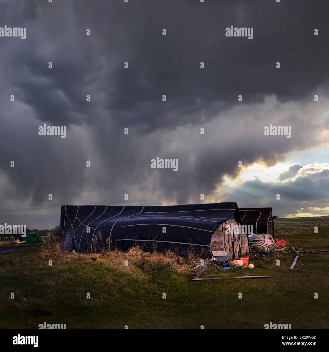 Upturned Herring boats used as fisherman's huts on Lindisfarne Island