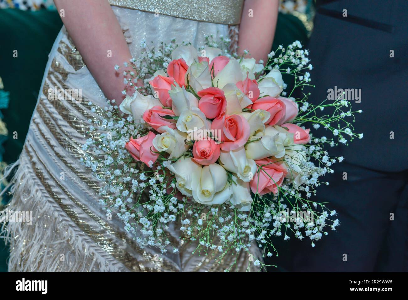 Arab bride holding a bouquet of roses Stock Photo