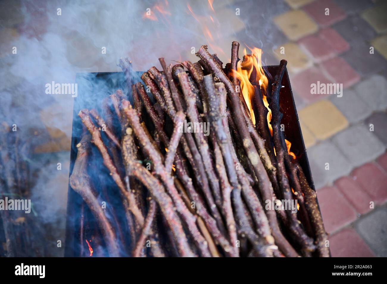 Top view burning tree branches on the fire on barbecue grill Stock