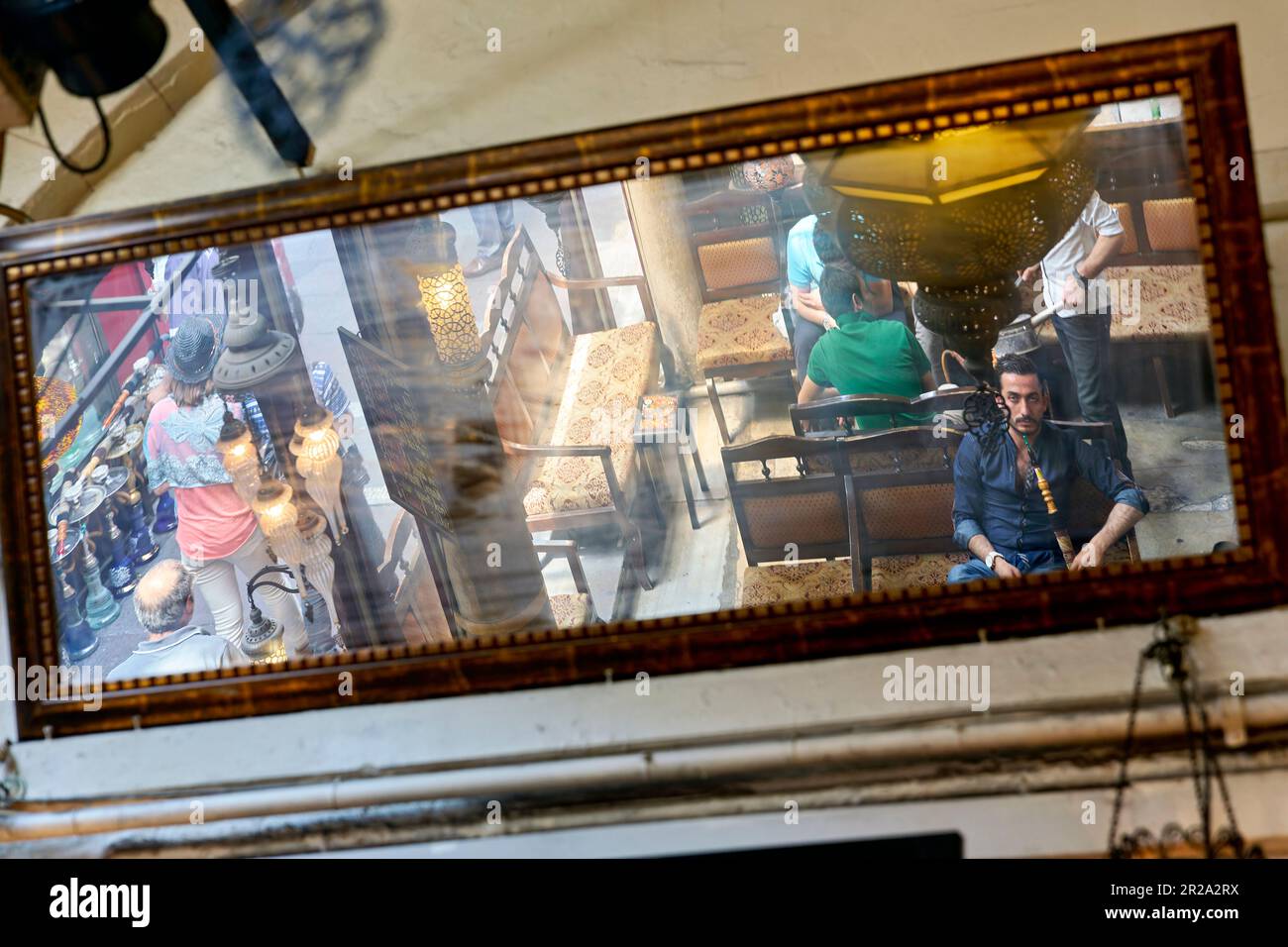 Istanbul Turkey. Men smoking through a hookah in a cafe Stock Photo