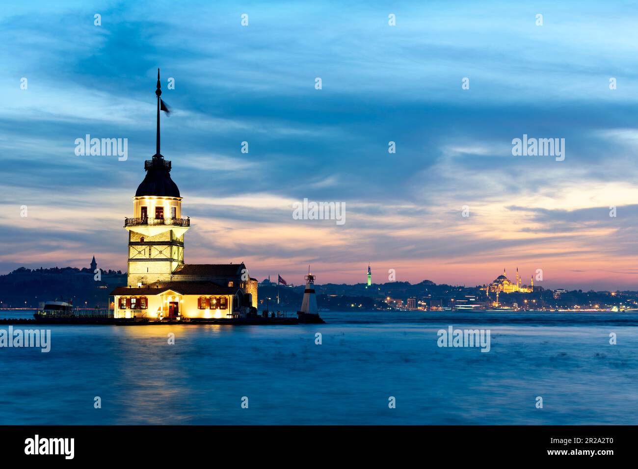 Istanbul Turkey. The Maiden's tower on the Bosphorus and the Süleymaniye Mosque at sunset Stock Photo