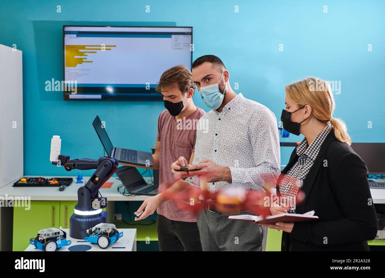 A group of students working together in a laboratory, dedicated to ...