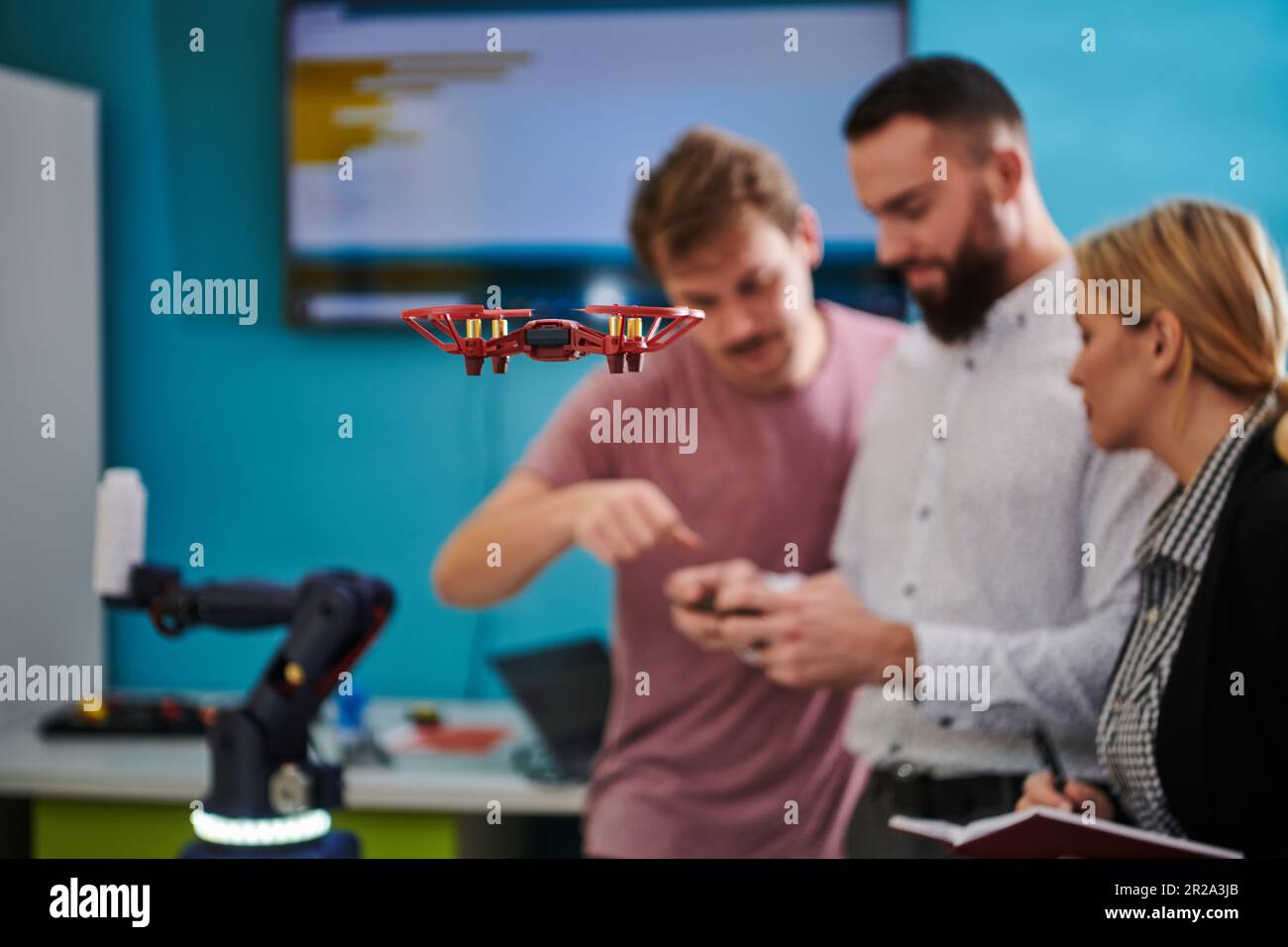 A group of students working together in a laboratory, dedicated to ...