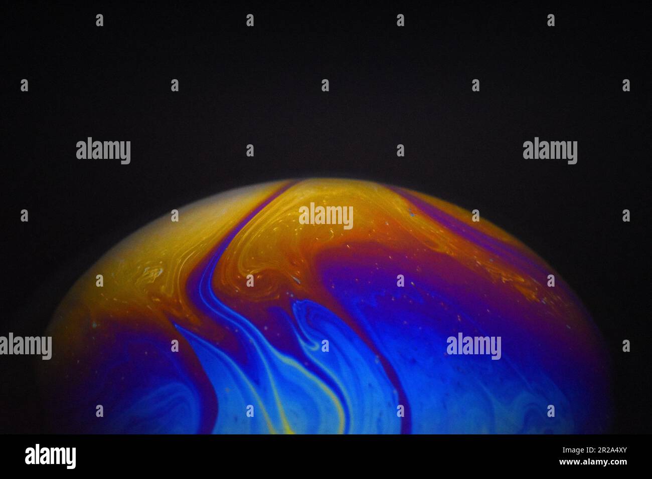 Light diffraction on soap bubble surface. Macro. Abstract Stock Photo