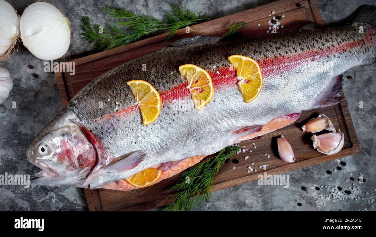 Cutting fresh fish before cooking Stock Photo Alamy