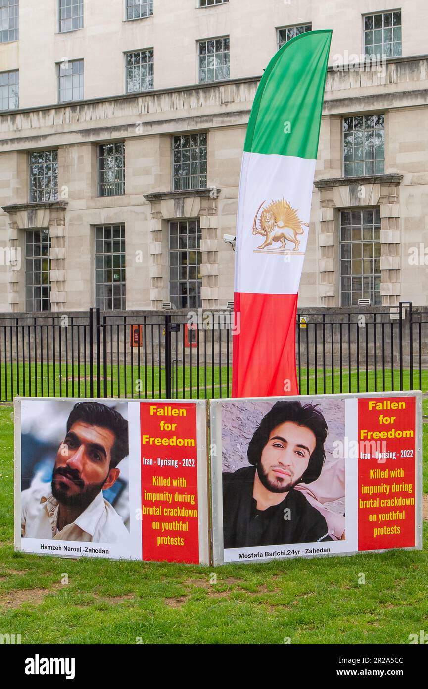 Whitehall, London, UK. 17th May, 2023. A Stop Execution in Iran Protest was held opposite Downing Street in London today. The protesters are calling on the Member States of the United Nations, including the UK,  to help change the 'Religious Dictatorship' Iranian regime. Photographs of those killed in Iran were put along a red carpet. Credit: DLeLife/Alamy Live News Stock Photo