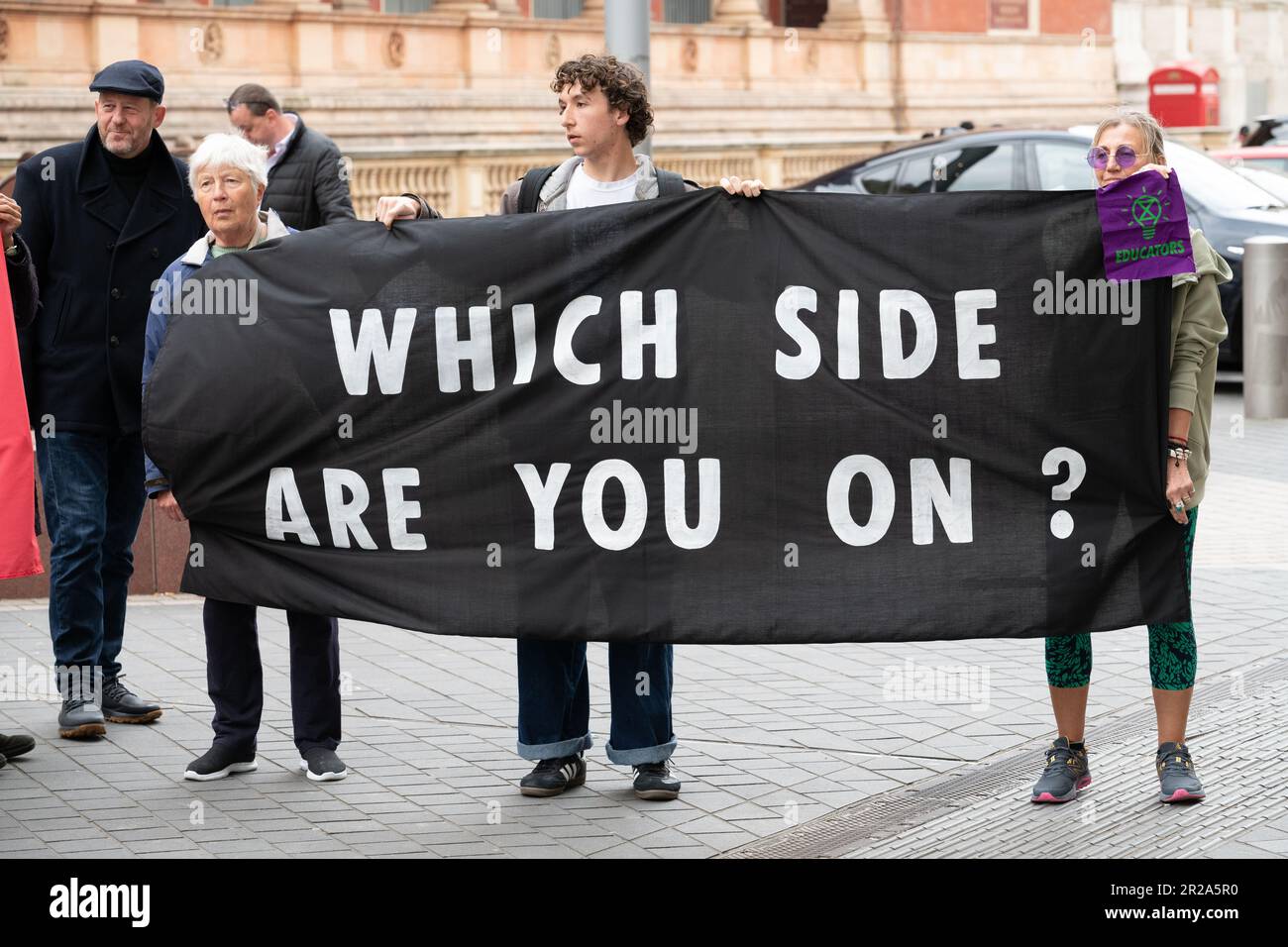 Climate activists hold a banner asking 'Which Side Are You On' during a protest against fossil fuel sponsorship of London's Science Museum. Stock Photo