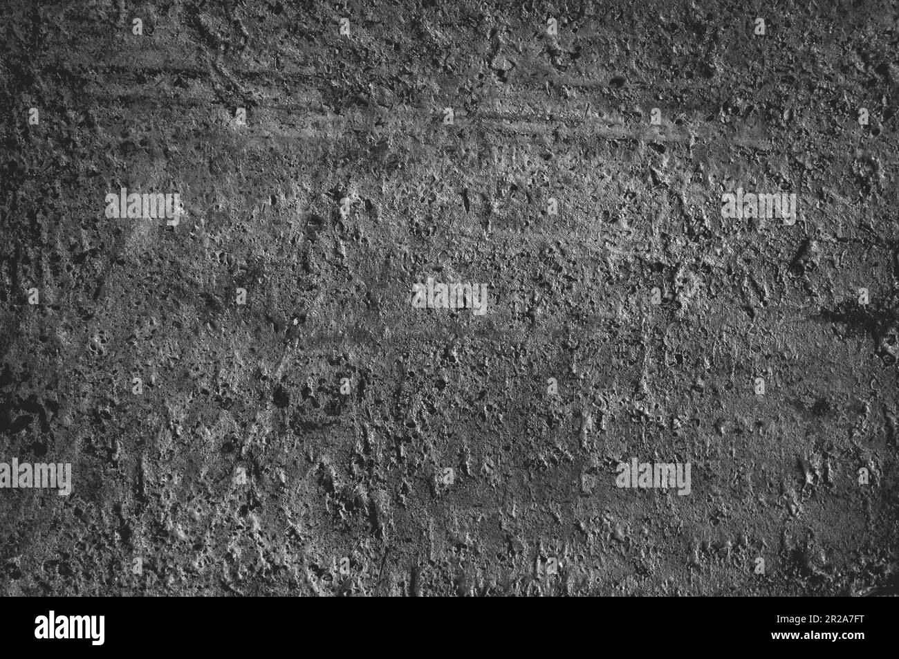 Concrete wall, floor. Porous texture, dark gray color. Rough texture of