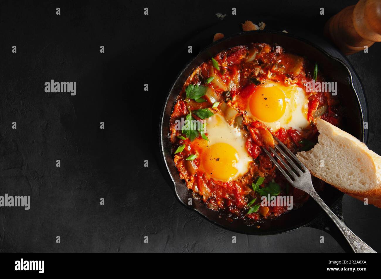 Eggs Poached in Spicy Tomato Pepper Sauce Stock Photo