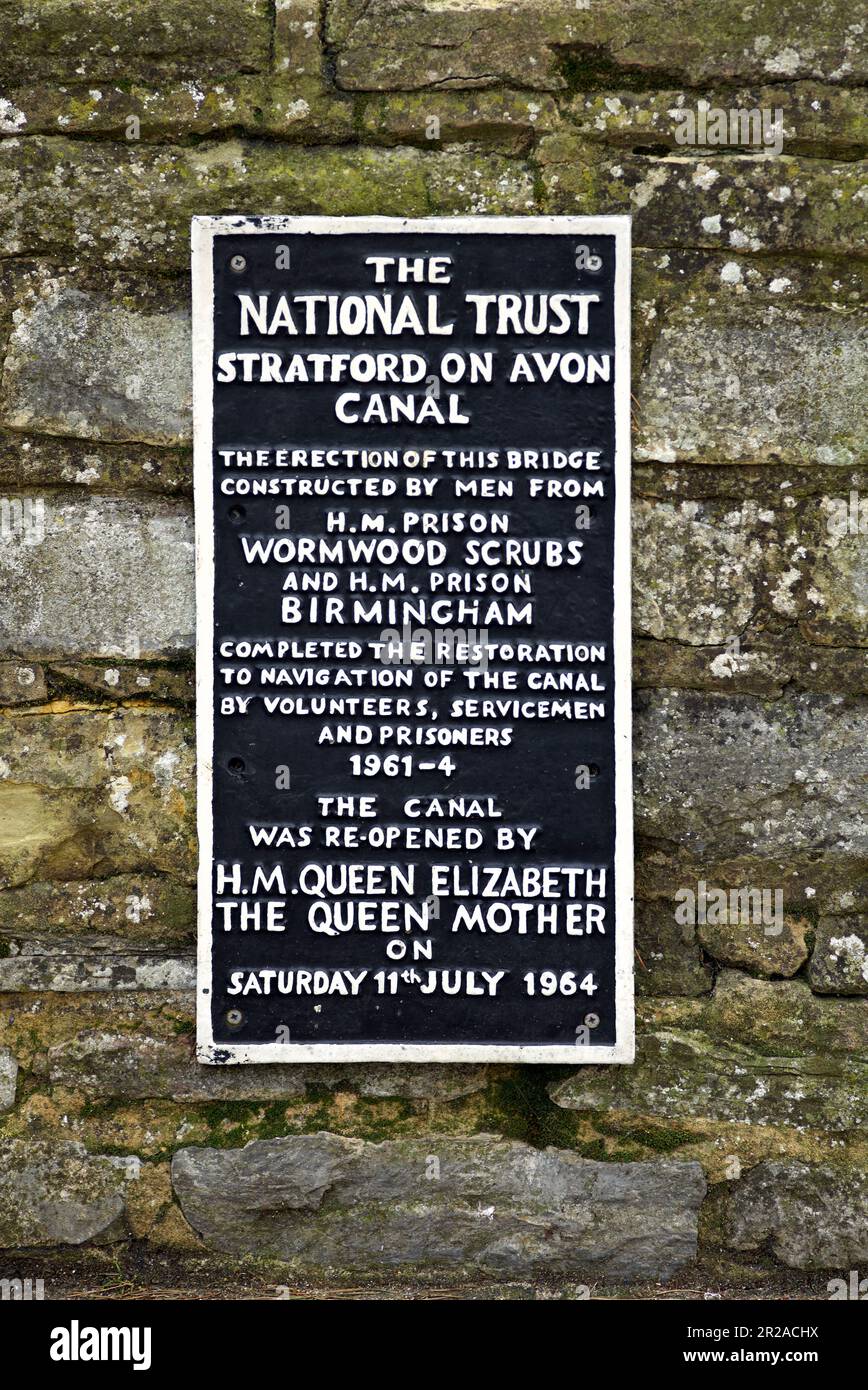 Metal plaque affixed to the wall at Stratford upon Avon canal detailing construction by inmates at Wormwood Scrubs and Birmingham prison. England UK Stock Photo