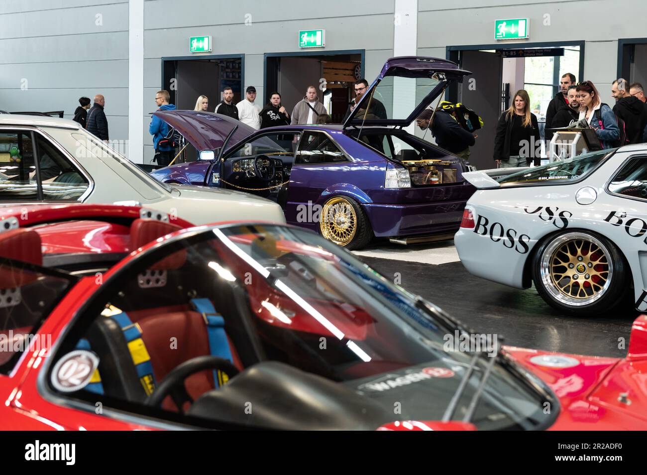 Friedrichshafen, Germany. 18th May, 2023. Visitors look at cars on