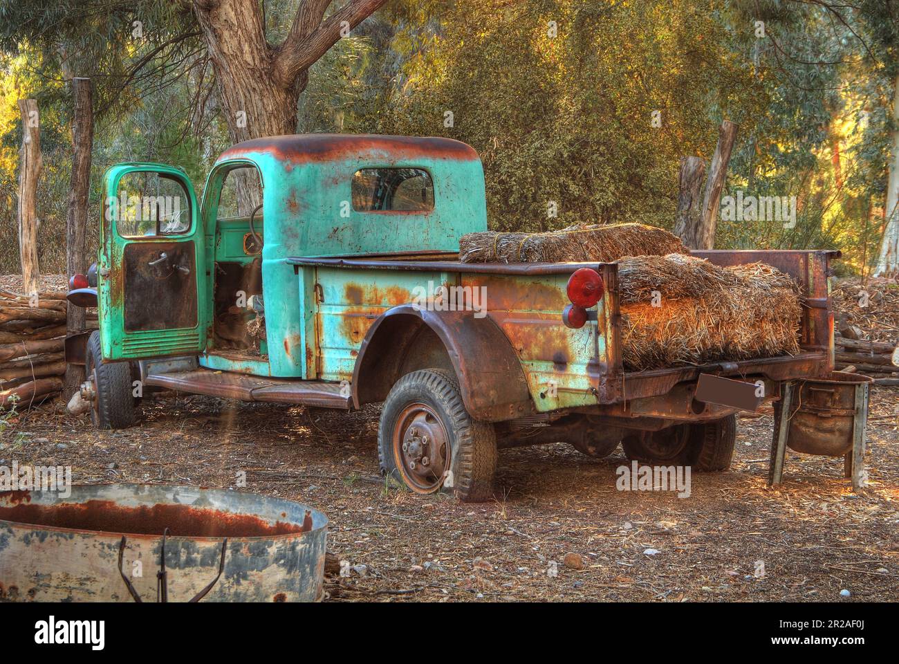 Broken down and rusty old truck with flat tires Stock Photo