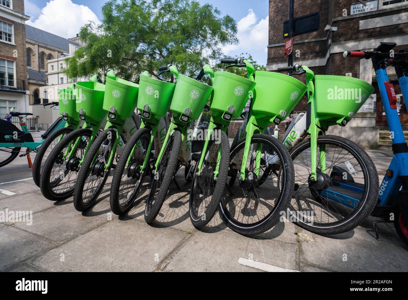 London UK. 18 May 2023 Lime electric hire bikes. Electric cycle hire companies such as Lime by Uber Human Forest and dott do not have parking bays unlike Santander. Westminster Council is