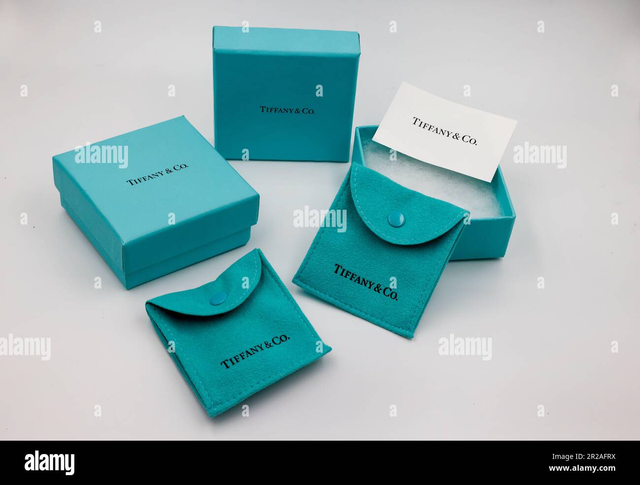 Tiffany & Co. blue jewellery boxes and pouches, isolated against white  background. Famous American jewelry store business headquartered in New  York Stock Photo - Alamy