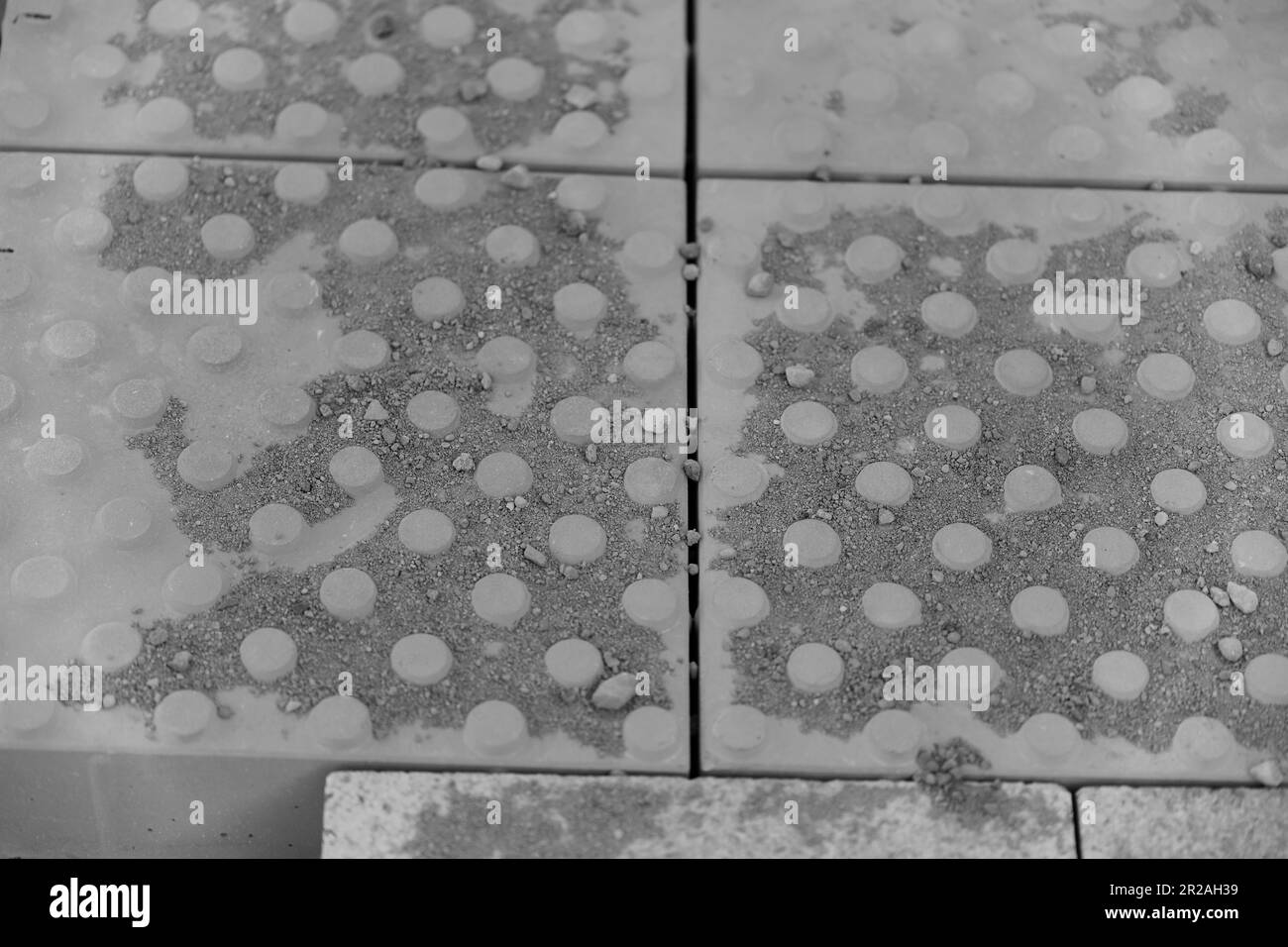 Concrete paving slabs covered with sand Stock Photo Alamy