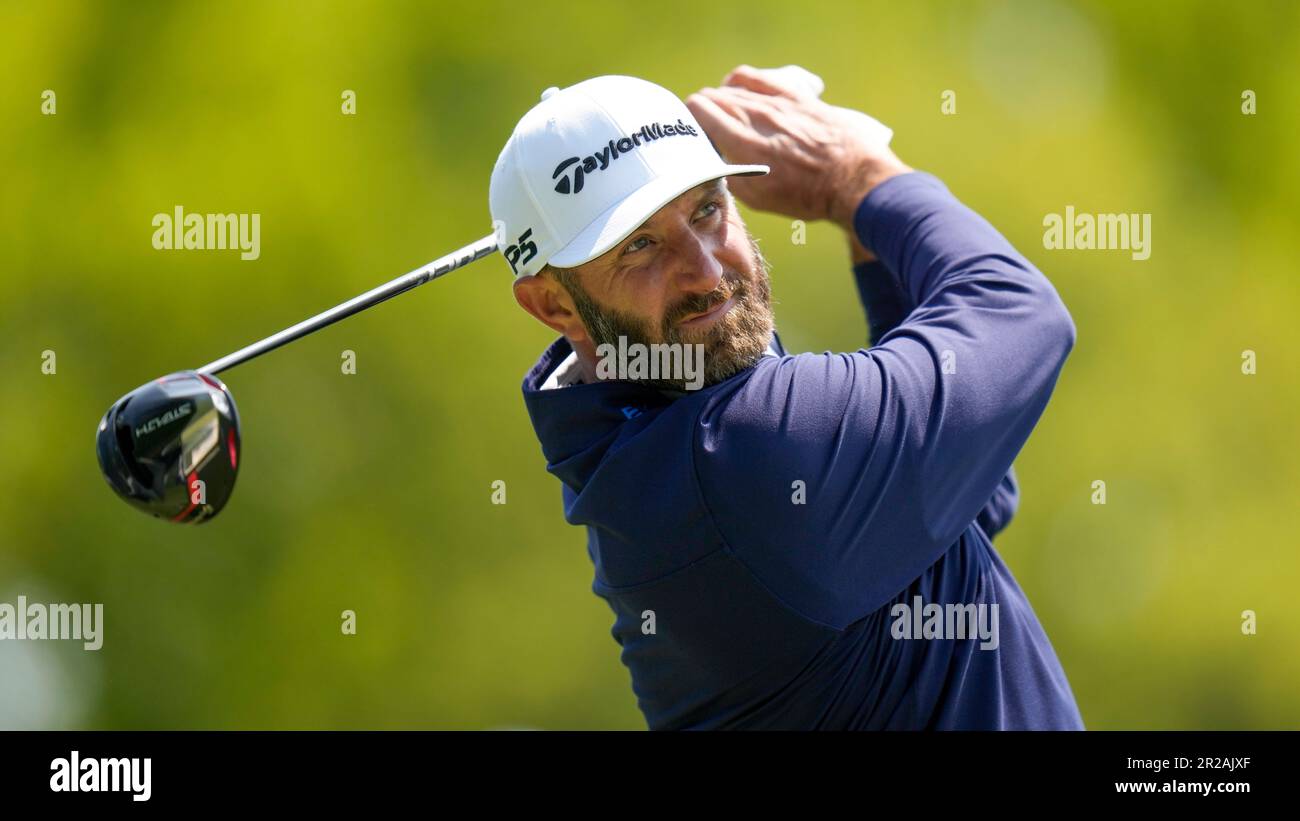 Dustin Johnson watches his tee shot during a practice round for the PGA