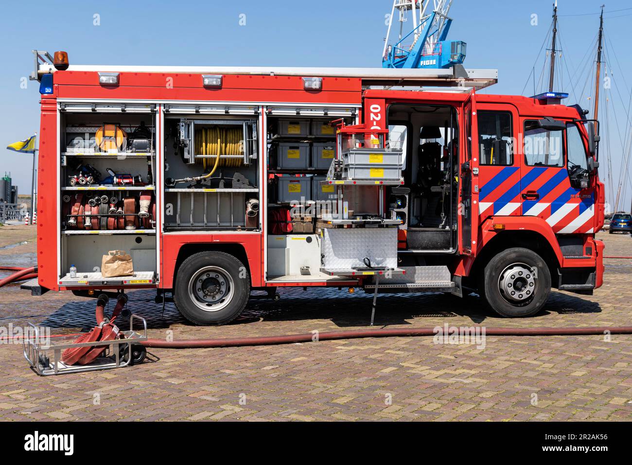 Dutch MAN LE fire engine with active blue emergency lighting Stock Photo