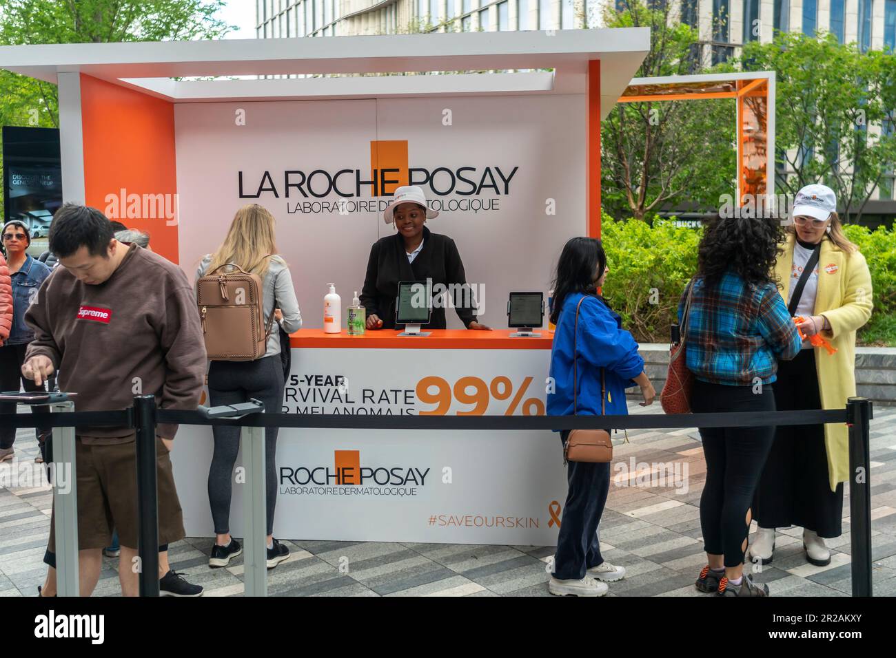 Visitors to Hudson Yards receive sunscreen samples after having their moles checked for skin cancer at a brand activation in Hudson Yards in New York for La Roche-Posay Laboratoire Dermatologique on Monday, May 1, 2023. La Roche-Posay is a brand of LÕOreal. (© Richard B. Levine) Stock Photo