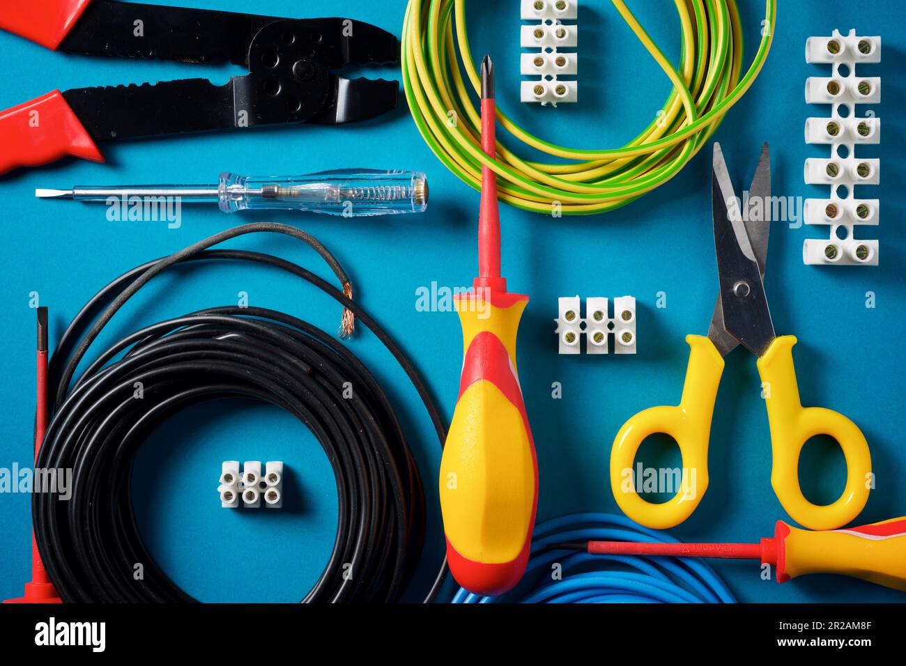 Electrician tools for various jobs on a blue table Stock Photo - Alamy