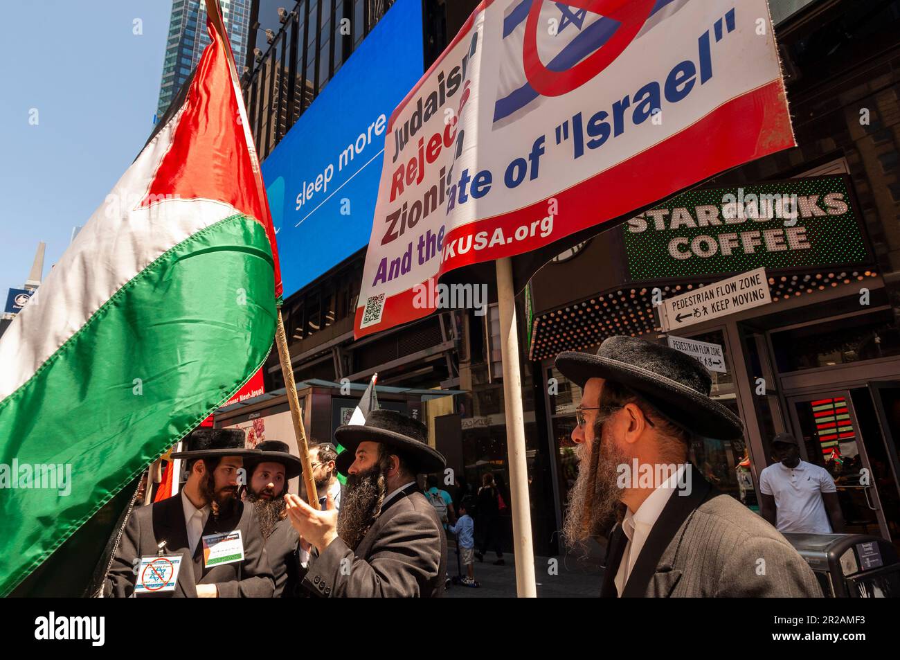 Orthodox Jewish members of the anti-Zionist Neturei Karta join Palestinians and their supporters protesting their treatment by the Israel government and celebrate Nakba Day, on Sunday, May 14, 2023 in Times Square in New York. (© Richard B. Levine) Stock Photo