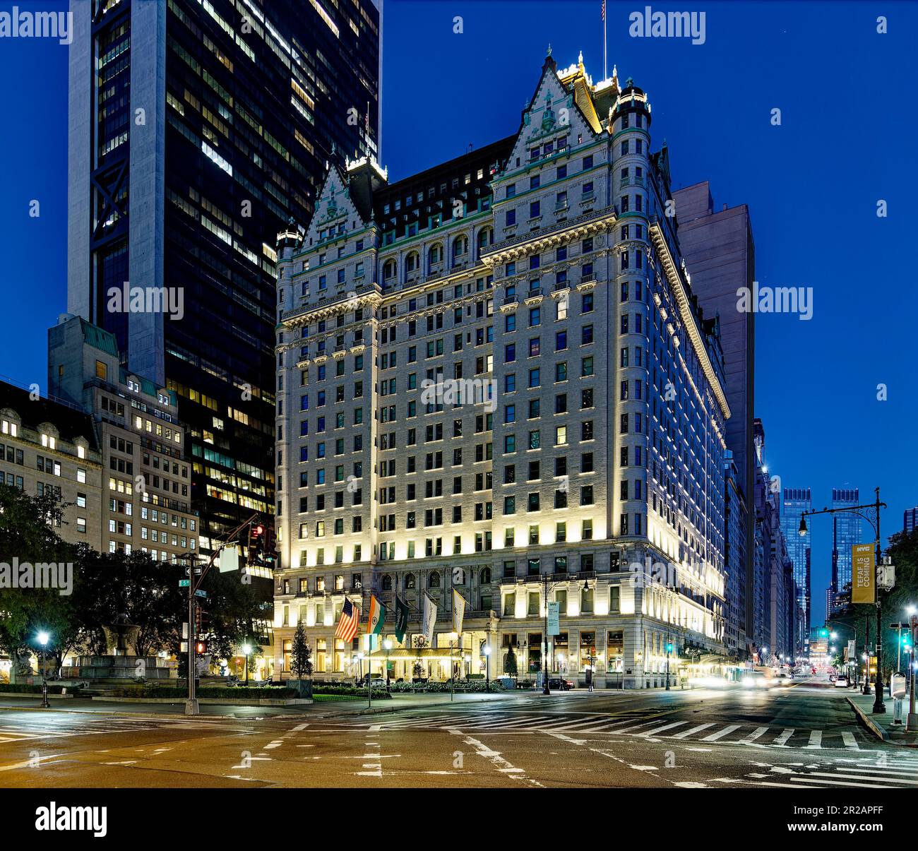 Light trails and floodlights wash the façade of New York’s iconic Plaza