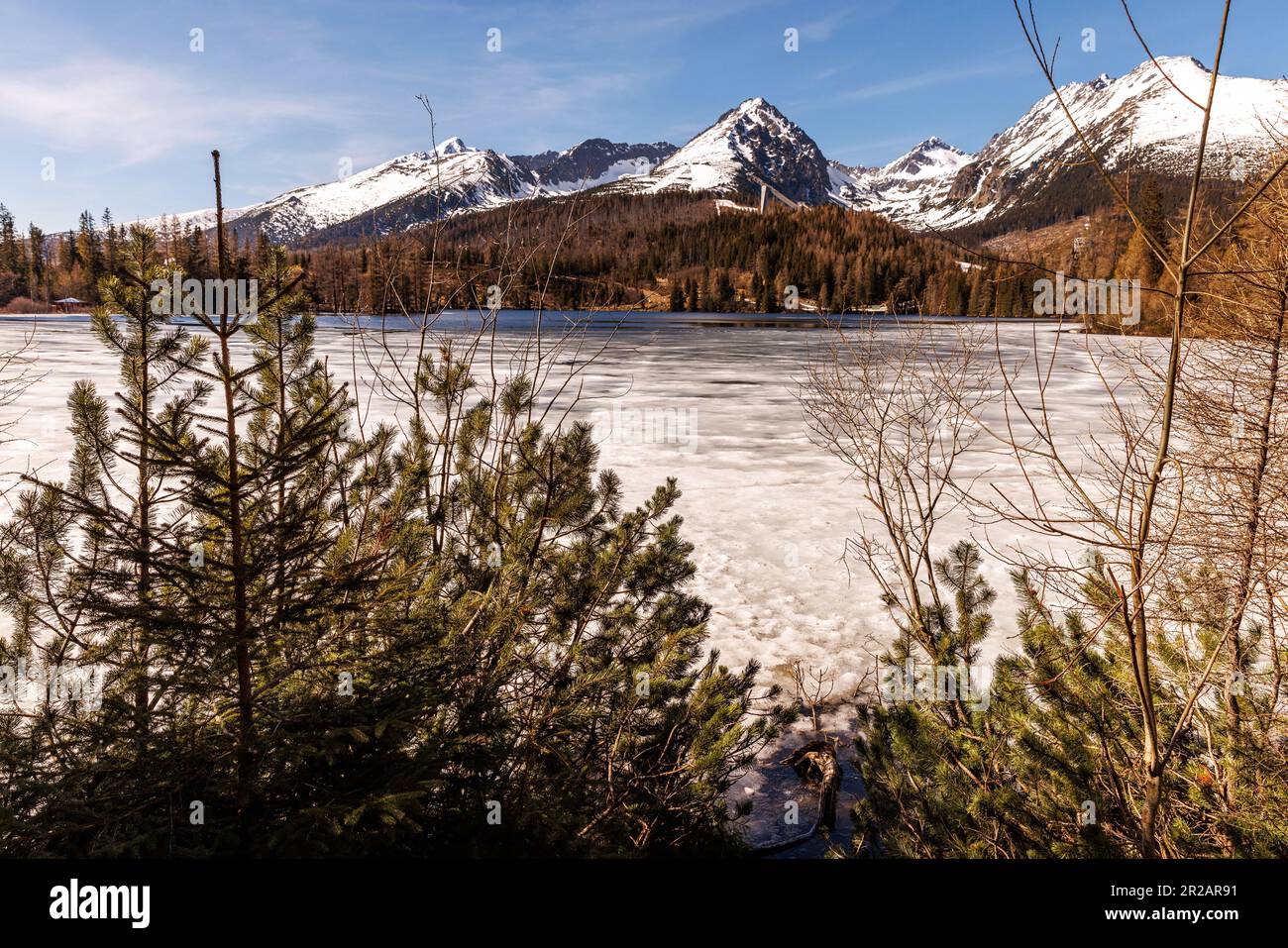Alpine lake with a snowy mountain backdrop Stock Photo - Alamy