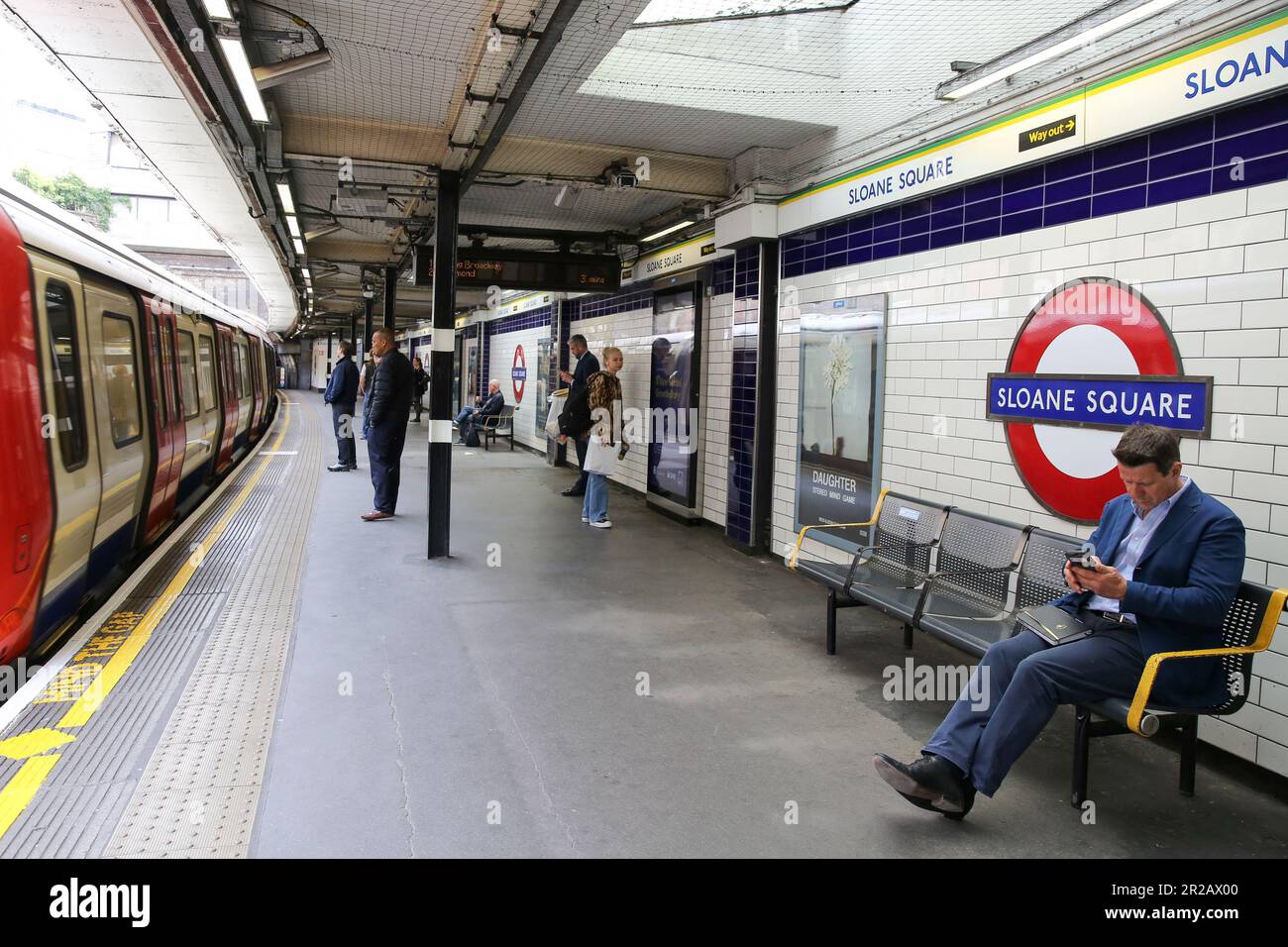 Passengers at Sloane Square London underground station. Stock Photo