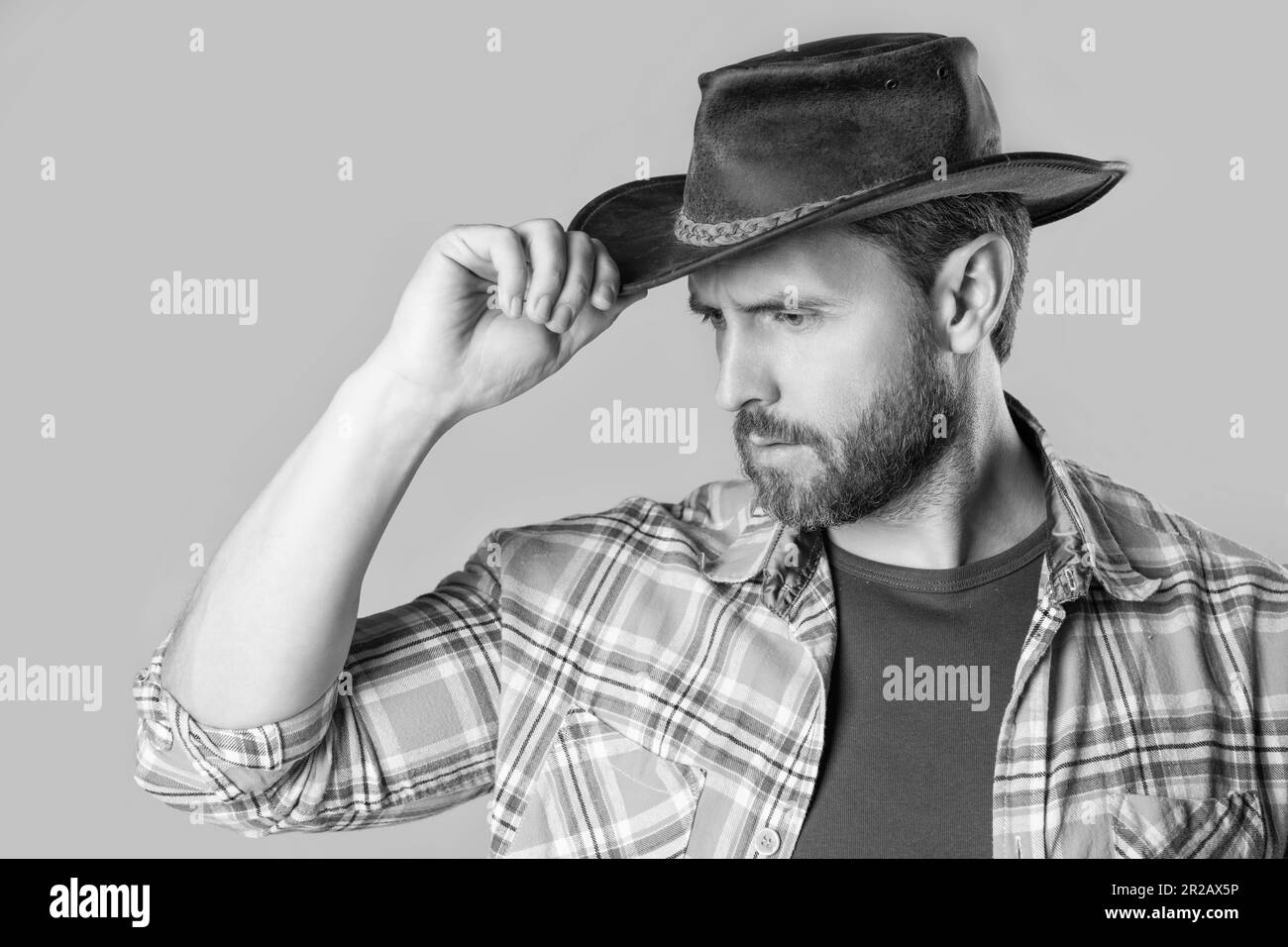 west man with cowboy hat isolated on grey background. west man in