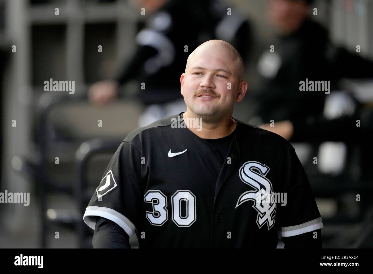 Chicago White Sox's Jake Burger walks through the dugout before a baseball  game between the White Sox and the Cleveland Guardians Wednesday, May 17,  2023, in Chicago. (AP Photo/Charles Rex Arbogast Stock