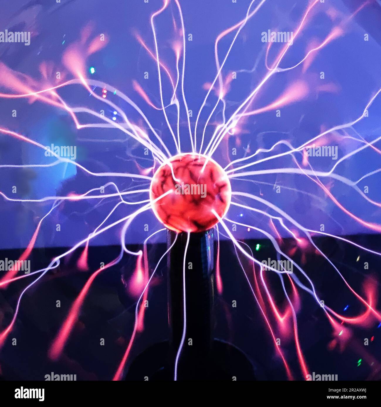 Tesla plasma ball with light beams inside, lightning effect, closeup
