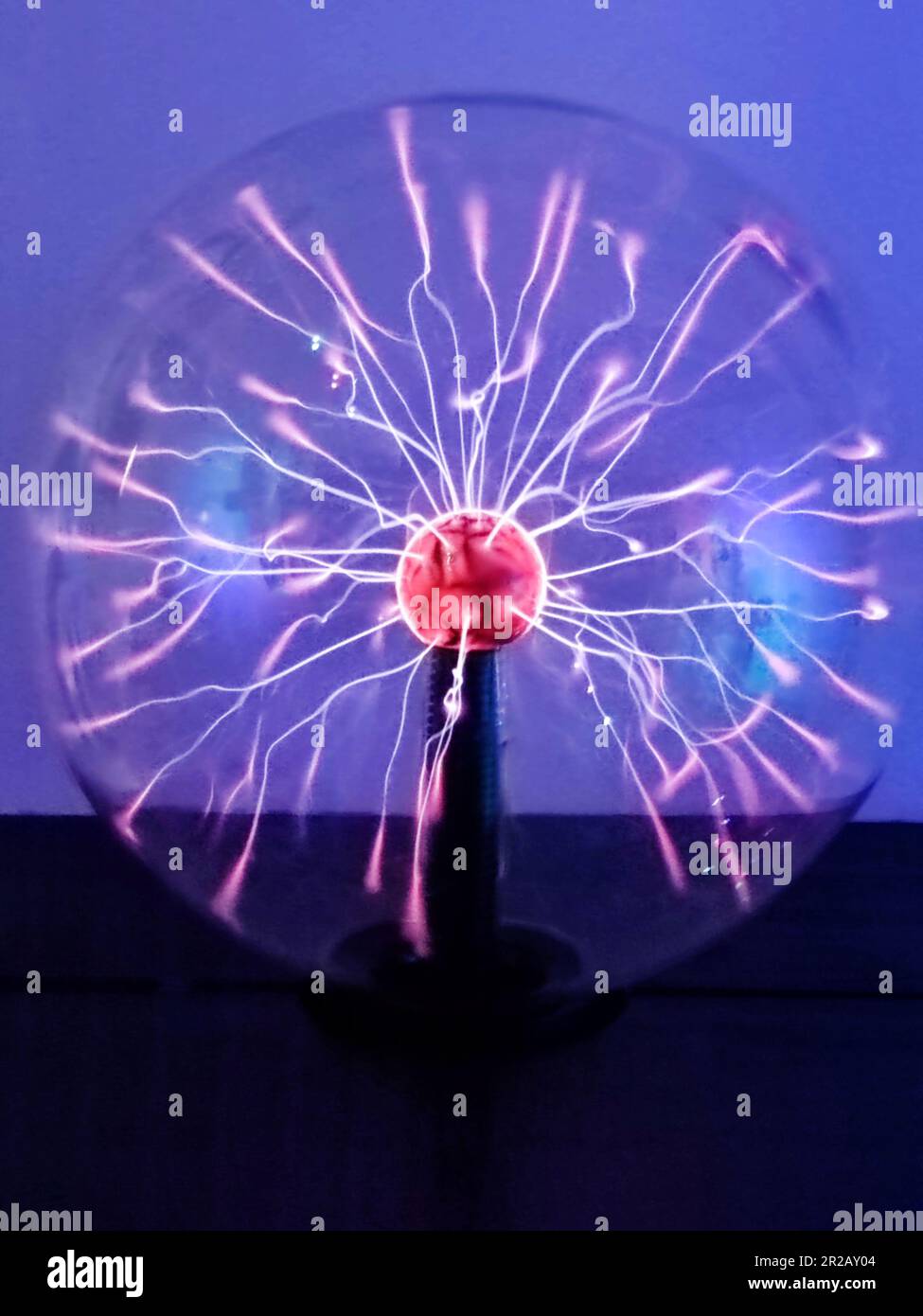 Tesla plasma ball with light beams inside, lightning effect Stock Photo Alamy