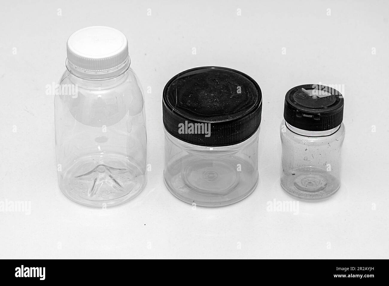 Empty closed plastic containers with lids isolated on white background Stock Photo