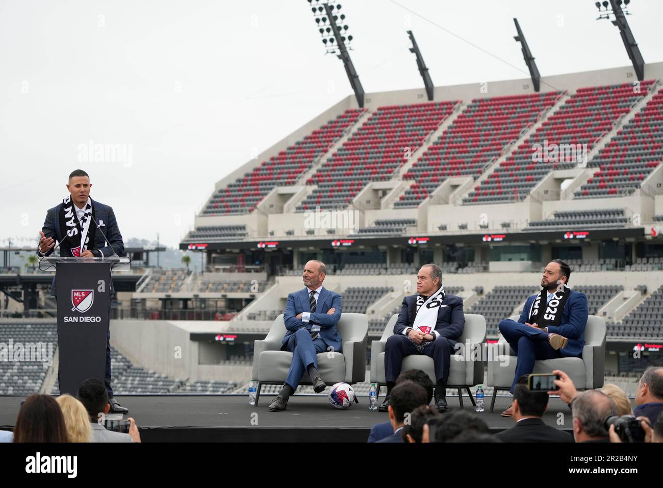San Diego Padres baseball player Manny Machado, left, speaks alongside